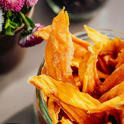 Mango — A bowl of dried mango strips